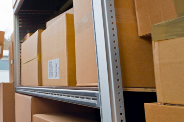 Cardboard boxes stacked on racks.